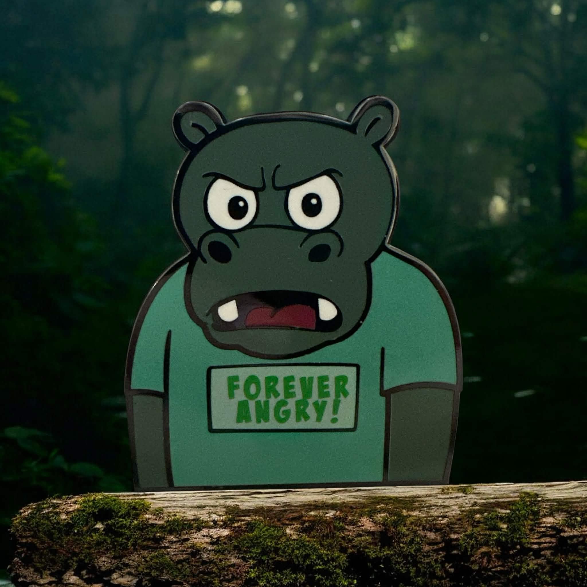 Hippo character called Bubbles in a swamp setting for the background image. Hippo is grey in color and wearing a teeshirt that says Forever Angry! in green text.