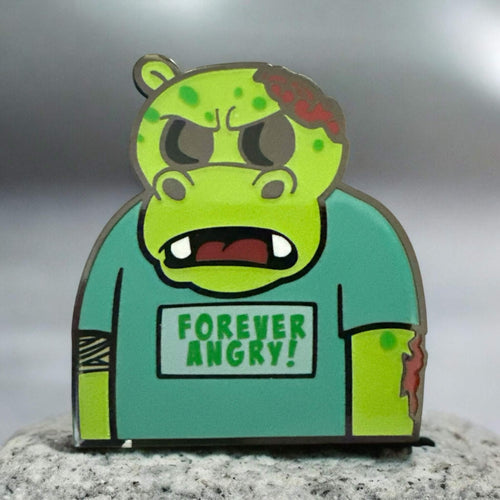 Hippo character called Bubbles in a neutral background image. Hippo is green in color and wearing a teeshirt that says Forever Angry! in green text. This is a zombie version of the original design.