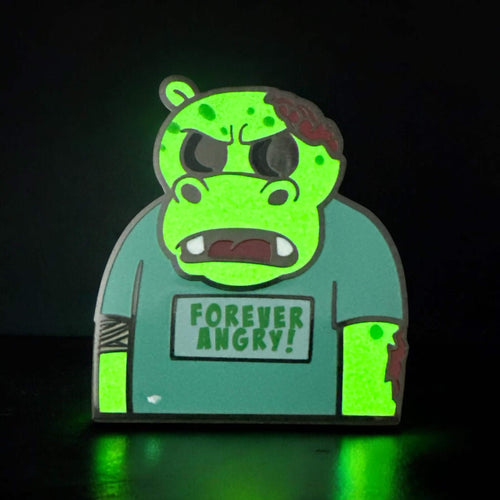 Hippo character called Bubbles in a neutral background image. Hippo is green in color and wearing a teeshirt that says Forever Angry! in green text. This is a zombie version of the original design.